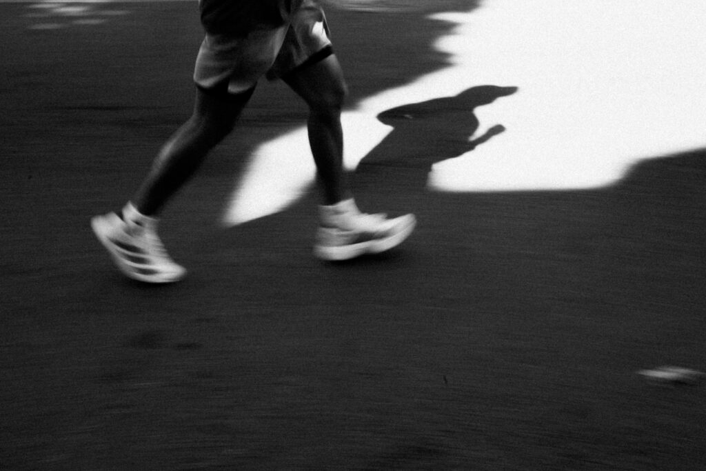 Runner's legs in motion, symbolizing endurance exercise and the gastrointestinal stress it can cause